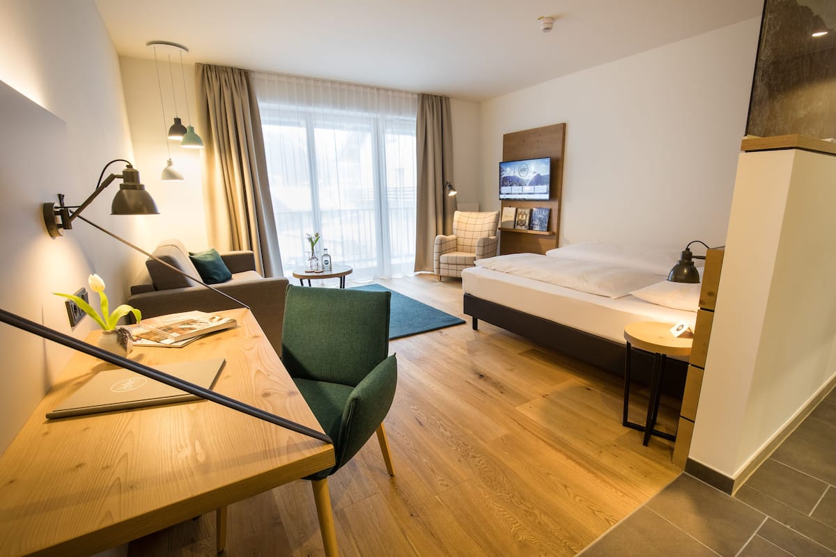 junior suite | 1 bedroom, in-room safe, blackout curtains, free wifi