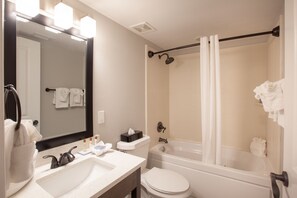 Bathtub, hair dryer, towels, soap