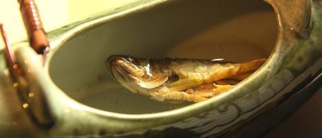 A fish in a ceramic bowl.