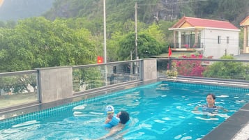 Outdoor pool, pool umbrellas, pool loungers