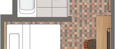 A bathroom with a bathtub, toilet, and sink.