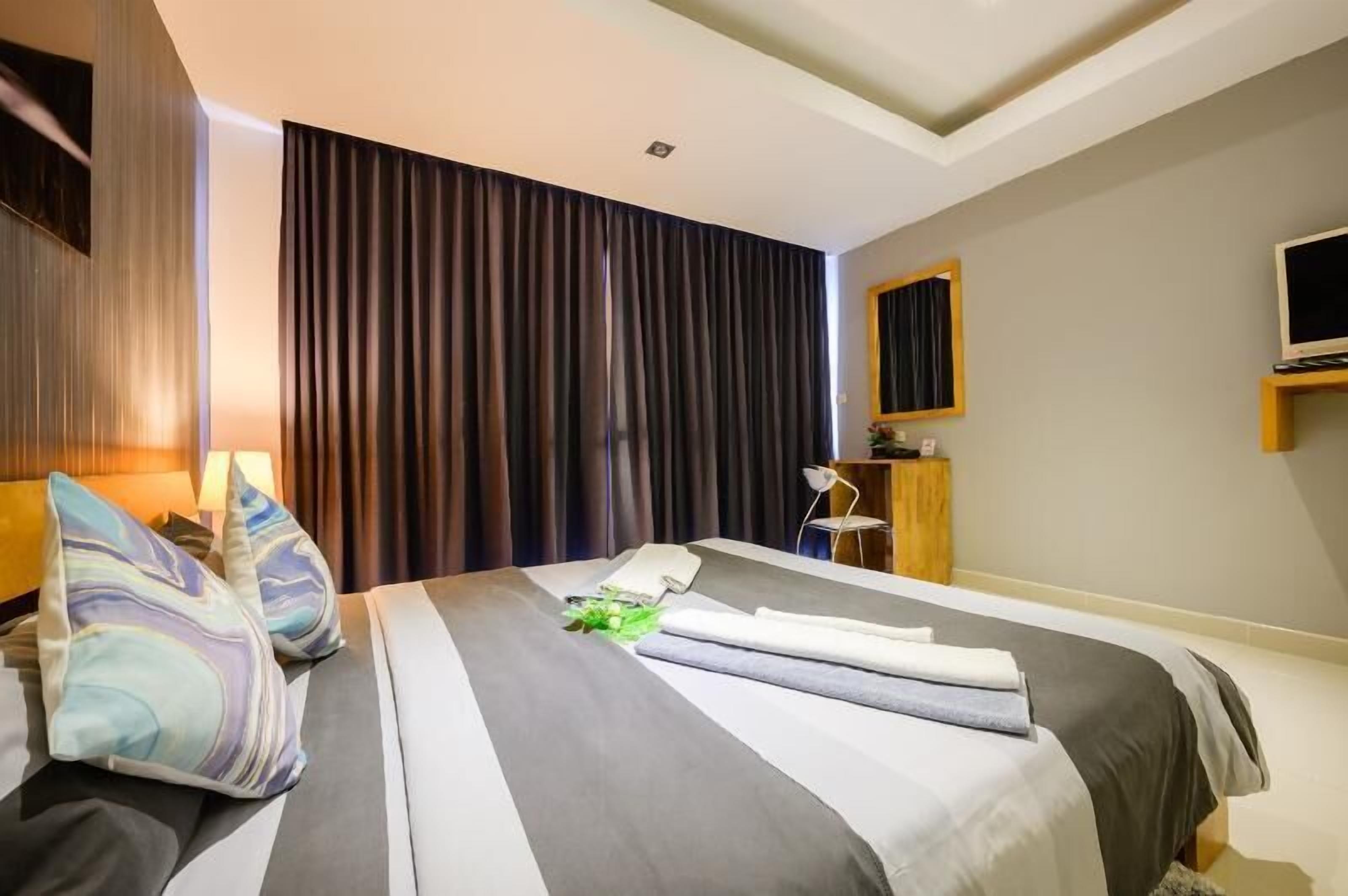 Down comforters, memory foam beds, in-room safe, desk