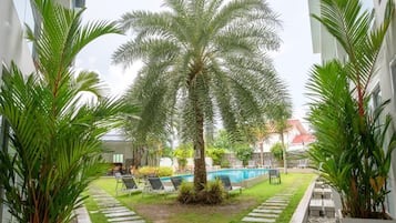 Outdoor pool, open 7:00 AM to 9:00 PM, sun loungers