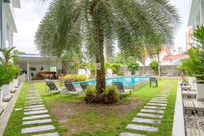 Outdoor pool, open 7:00 AM to 9:00 PM, sun loungers