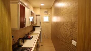 Apartment, 3 Bedrooms | Private kitchen | Mini-fridge, microwave, stovetop, electric kettle