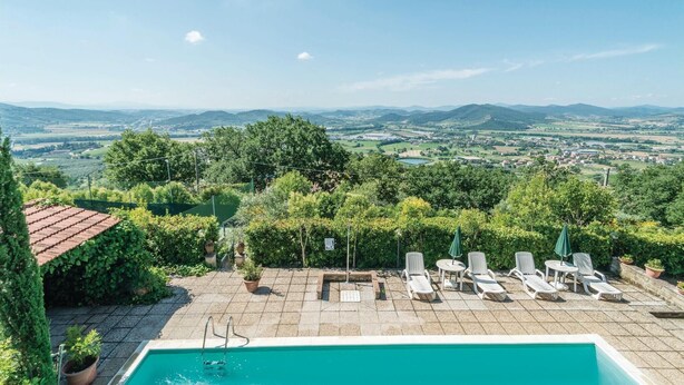 A pool area with lounge chairs and a view of the countryside. - Amazing apartment in Magione -PG- with WiFi (Magione -PG-)