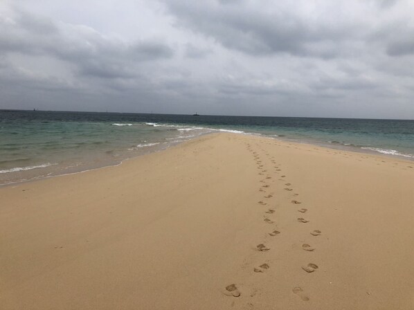 On the beach, white sand, beach shuttle