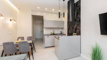 Design Apartment (Sverdlova Street 24) | Private kitchen | Fridge, microwave, stovetop, coffee/tea maker