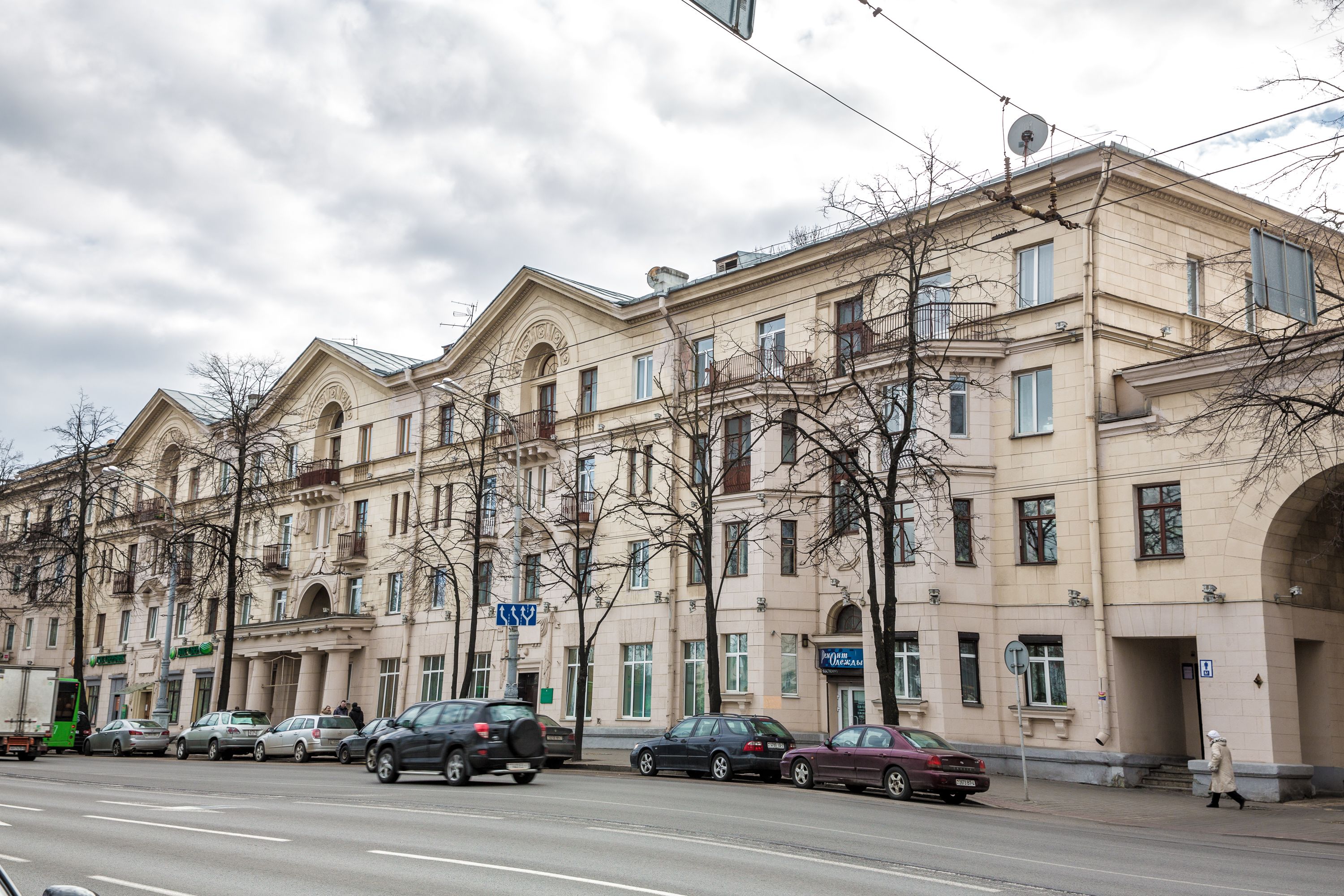 A row of multi-story buildings with a classic architectural style, featuring large windows and balconies.