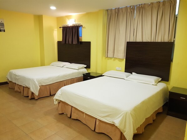 Family Quadruple Room | Desk, iron/ironing board, free WiFi, bed sheets - New City Hotel (Kajang)
