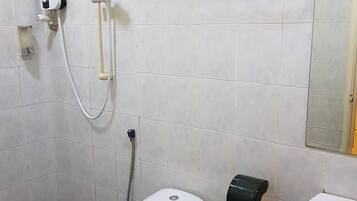 A bathroom with a toilet, a sink, a towel rack, and a hand dryer.