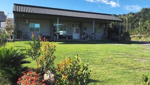 A two-story building with a flat roof, large windows, and a covered porch. - 6636 B&B (Taitung)