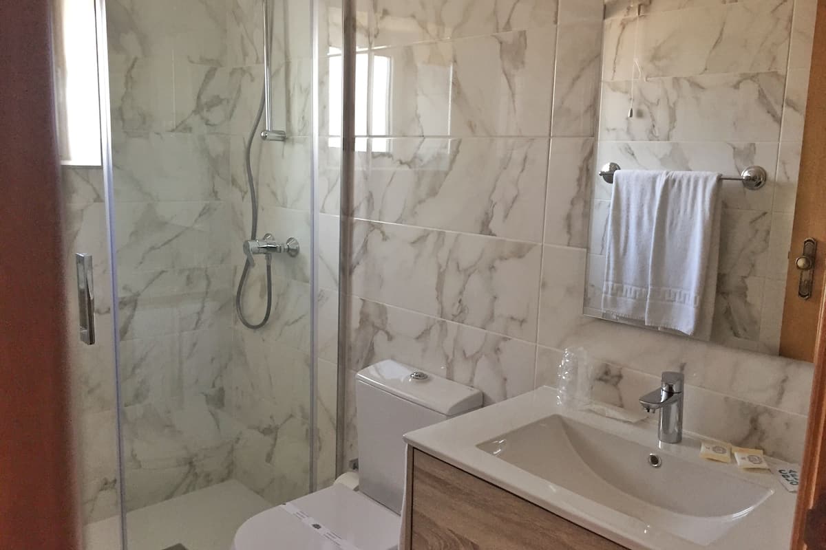 traditional double room | bathroom | free toiletries, hair dryer, towels