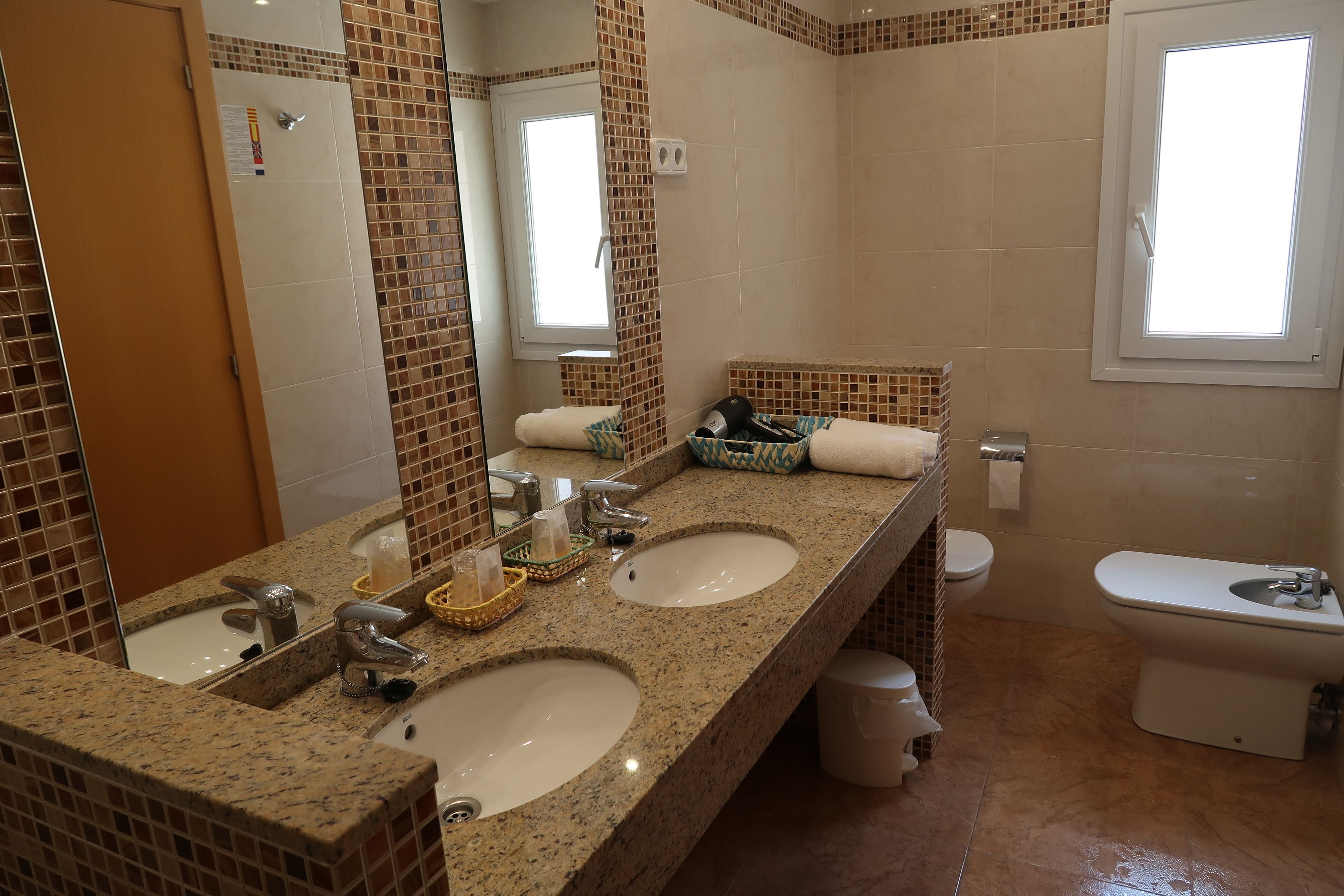 superior double room | bathroom | free toiletries, hair dryer, towels