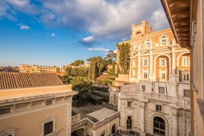 A historic building with classical architecture, featuring arched windows and a central courtyard. - Imperial Panorama Penthouse (Rome)