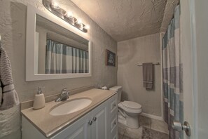 Combined shower/bathtub, hair dryer, towels, soap