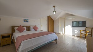 A bedroom with a bed, bedside tables, a window, and a chair. - Infinity Civan Villa (Fethiye)