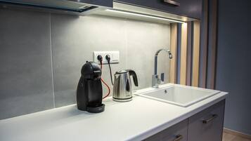 Deluxe Apartment | Private kitchen | Fridge, microwave, stovetop, espresso maker