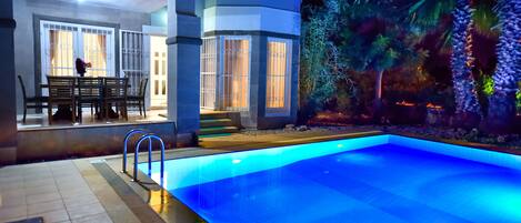 Seasonal outdoor pool, pool umbrellas, pool loungers