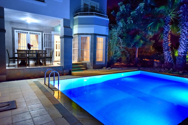 Seasonal outdoor pool, pool umbrellas, pool loungers