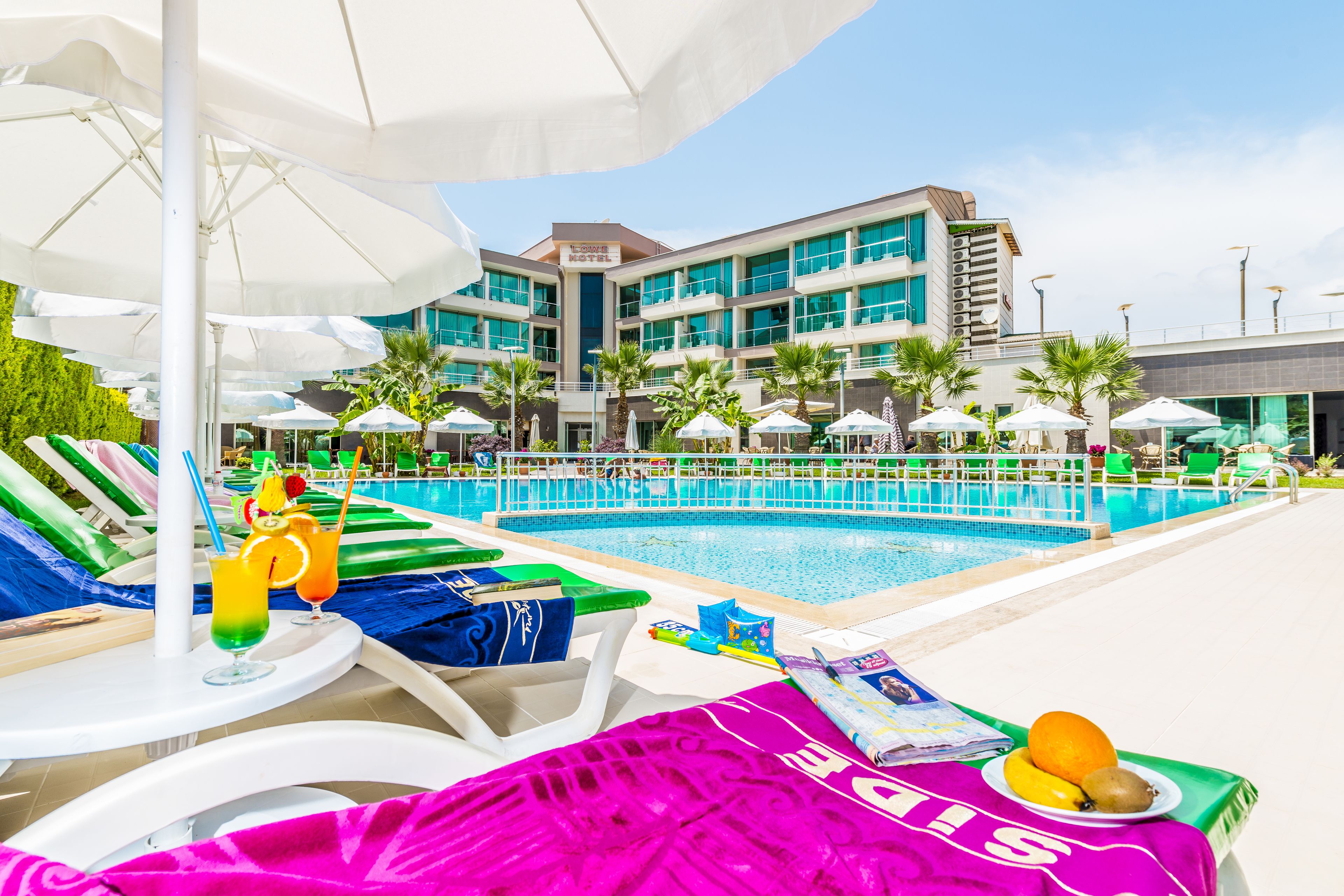 outdoor pool, pool umbrellas, pool loungers