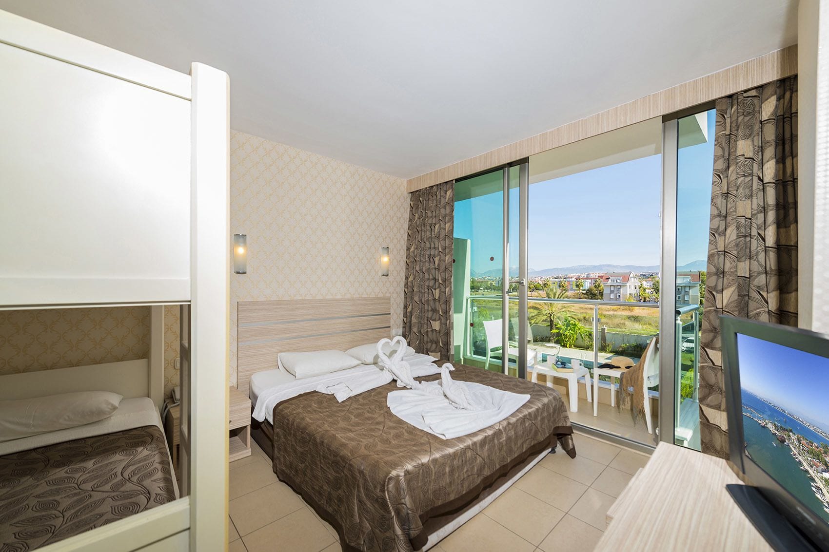 standard triple room, 1 bedroom, accessible, balcony | living area | lcd tv