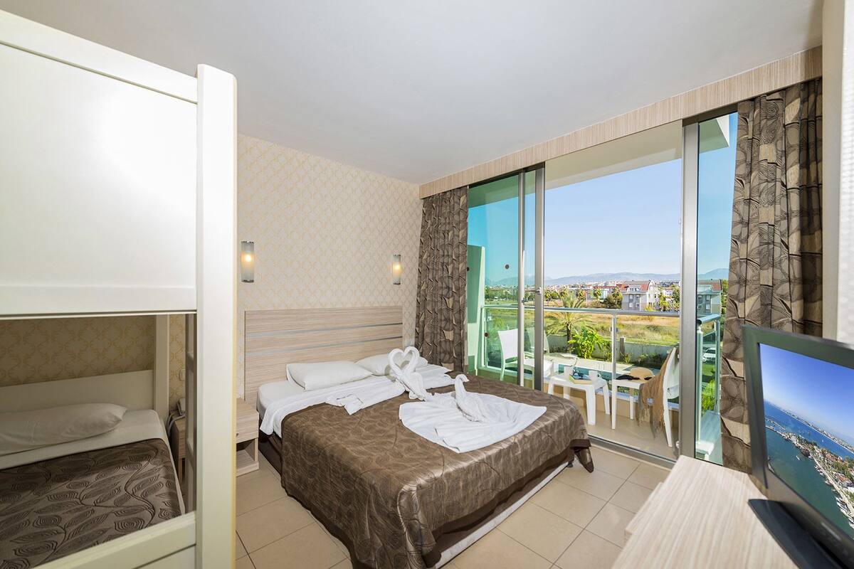 standard triple room, 1 bedroom, accessible, balcony | living area | lcd tv