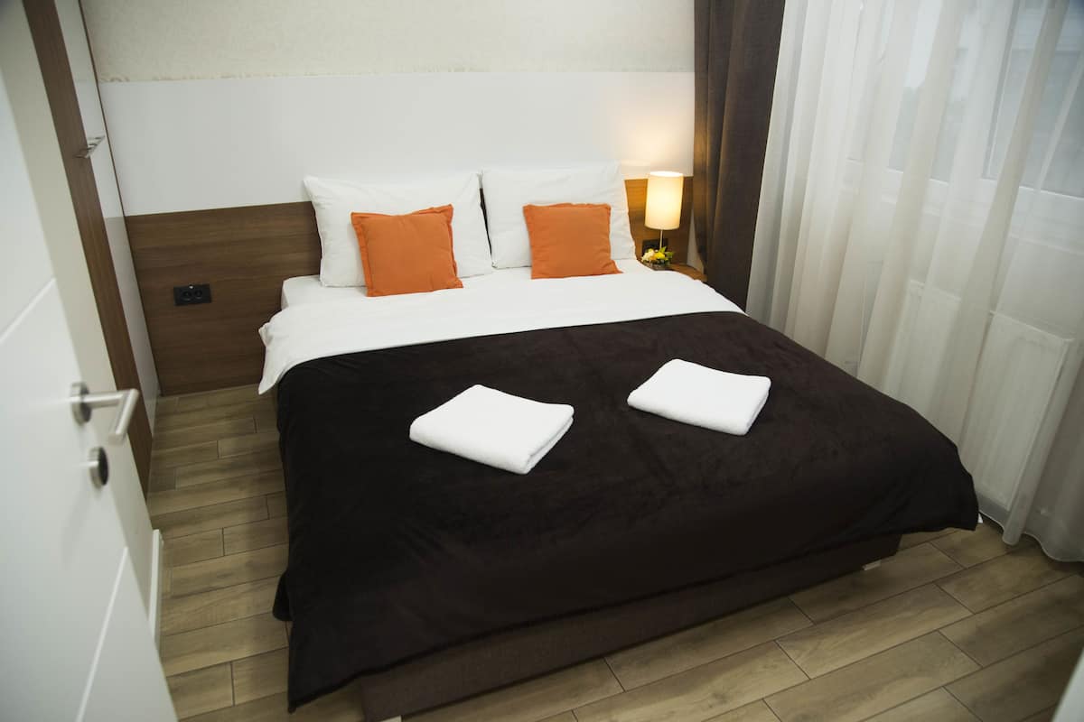 Apartamento, 1 quarto | Roupas de cama premium, escrivaninha, cortinas blackout
