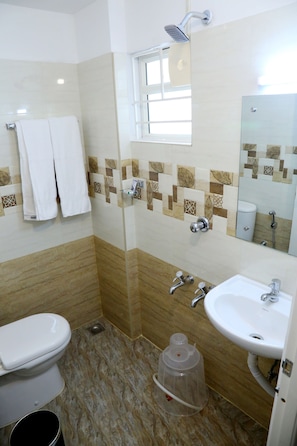 Shower, rainfall showerhead, towels