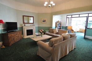 Flat-screen TV, books, video library