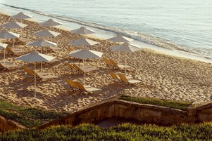 On the beach, sun loungers, beach towels