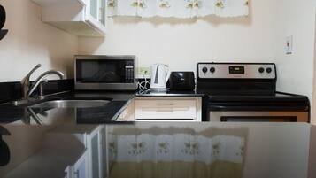 Luxury Apartment, 2 Bedrooms, Mountain View | Private kitchen | Coffee/tea maker, full-size fridge, microwave, oven