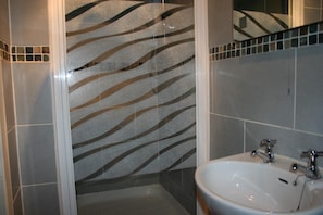 Shower, free toiletries, hair dryer, towels