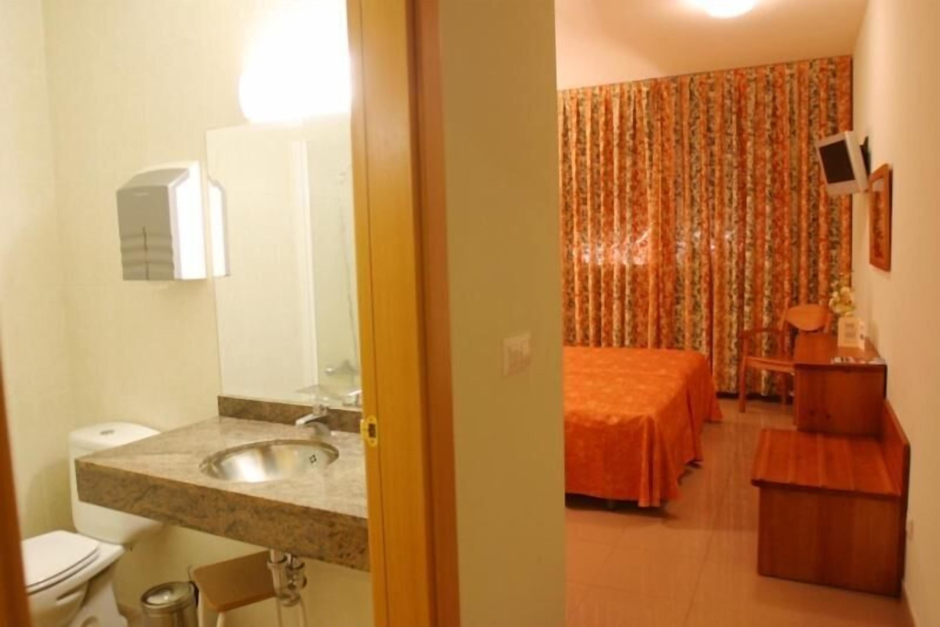 hypo-allergenic bedding, desk, laptop workspace, blackout curtains