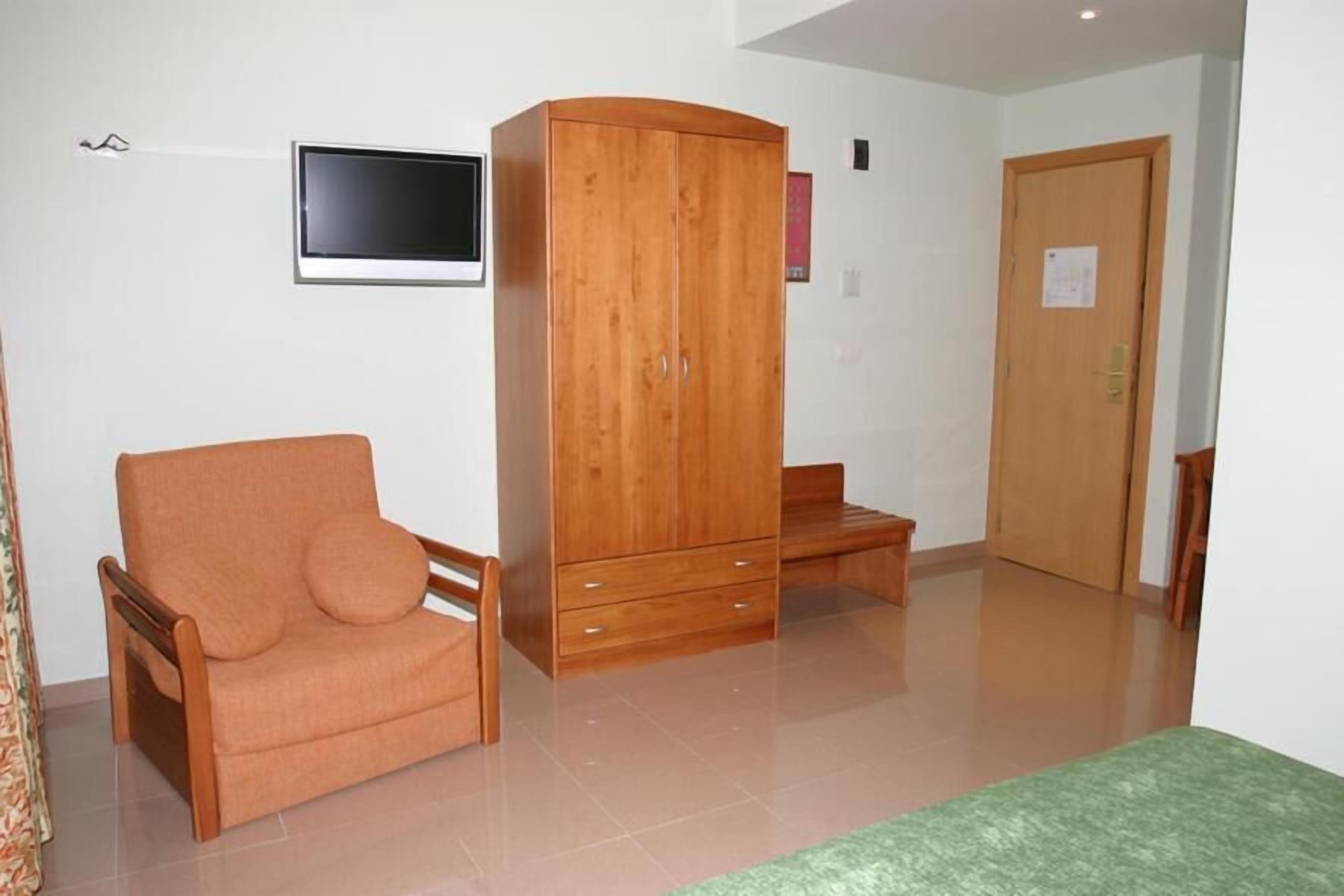 hypo-allergenic bedding, desk, laptop workspace, blackout curtains