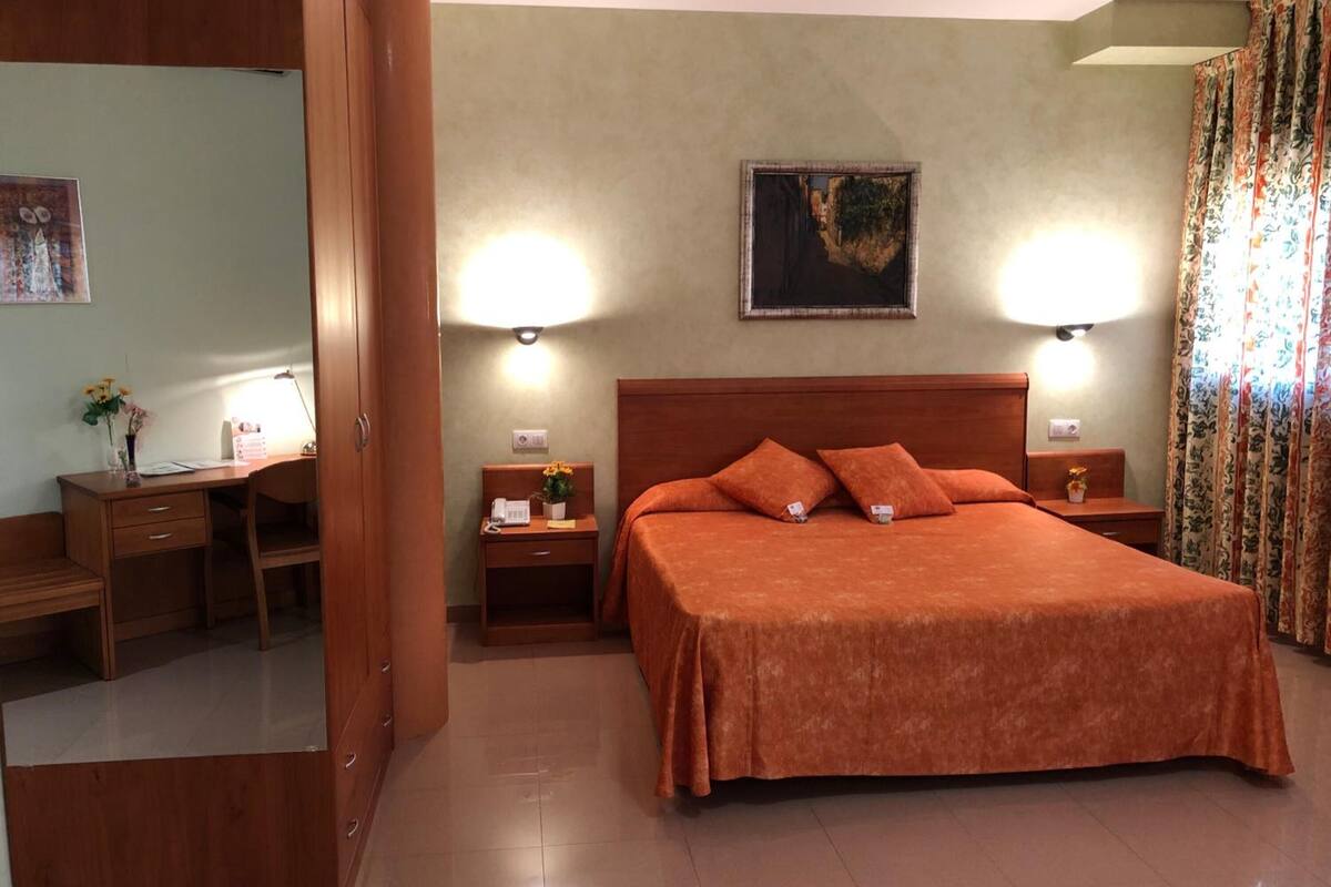 family quadruple room | hypo-allergenic bedding, desk, laptop workspace, blackout curtains