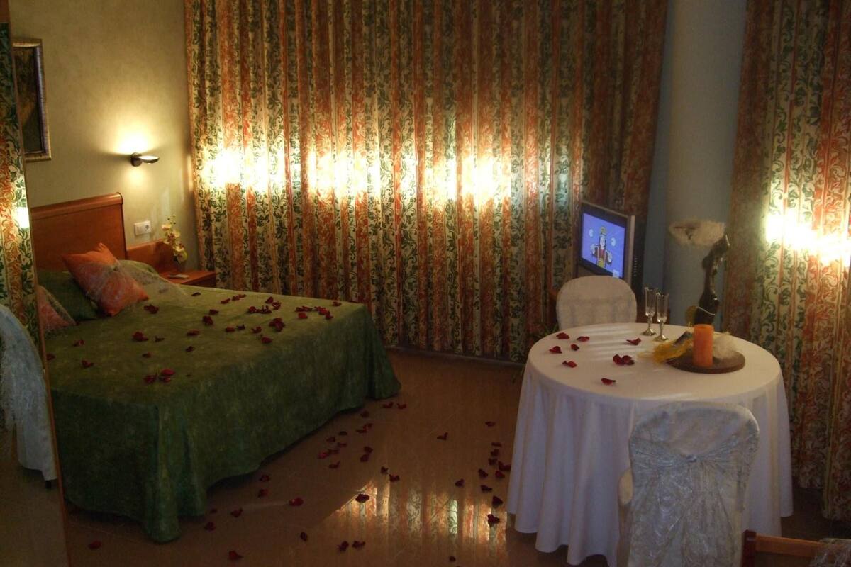 hypo-allergenic bedding, desk, laptop workspace, blackout curtains