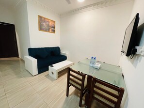 Deluxe Apartment, 1 Bedroom | Living area | Flat-screen TV - Gateway Salalah (Salalah)