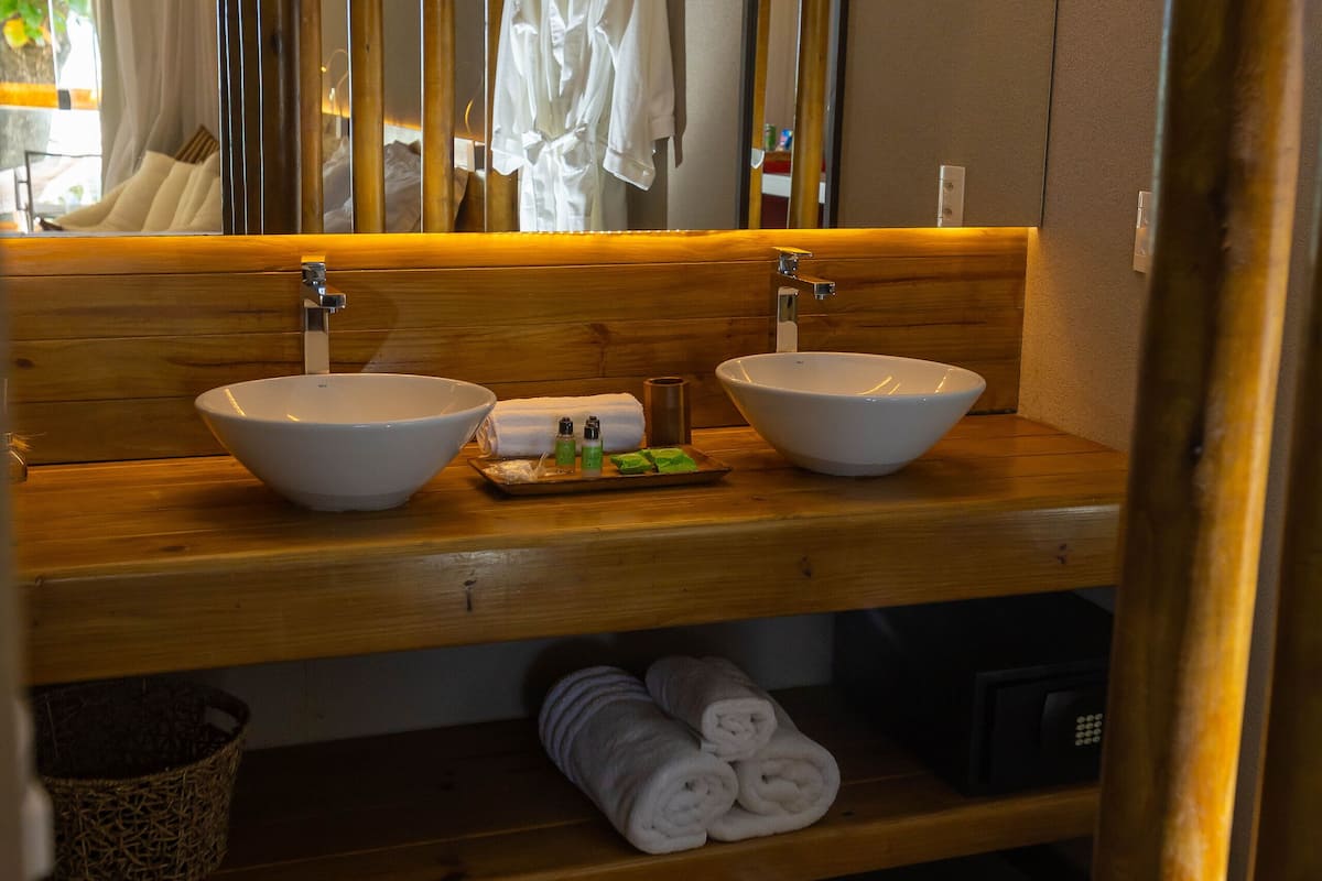 grand suite | bathroom | shower, designer toiletries, hair dryer, bathrobes