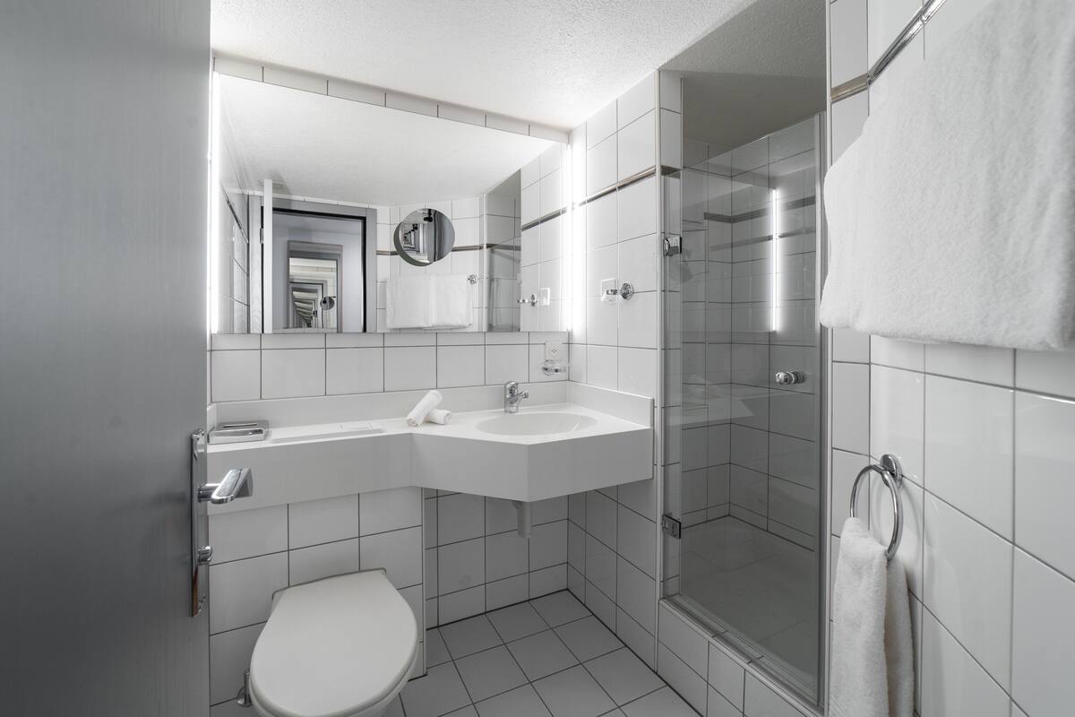 combined shower/bathtub, deep-soaking bathtub, hair dryer, bathrobes