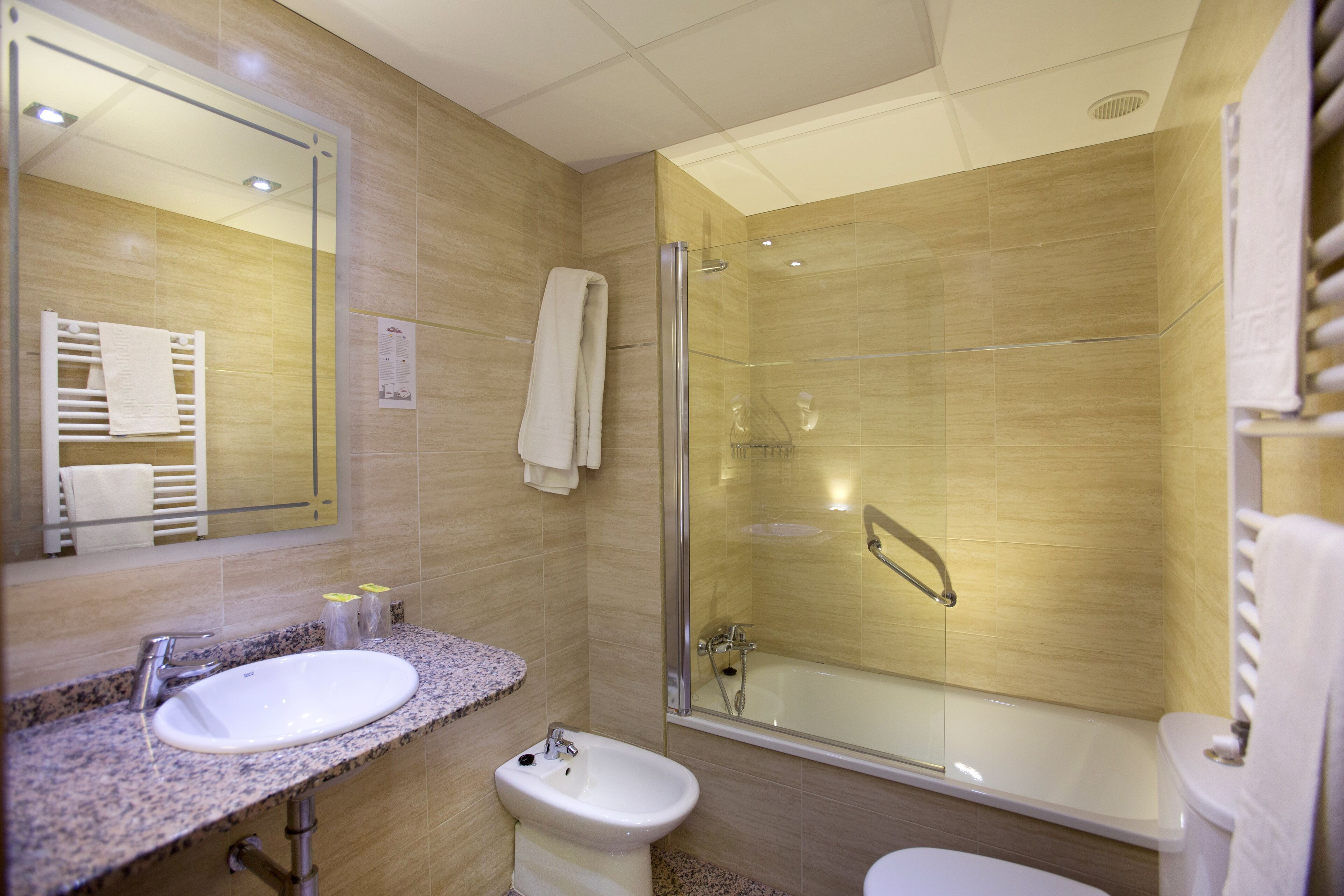 deep-soaking bathtub, free toiletries, hair dryer, towels