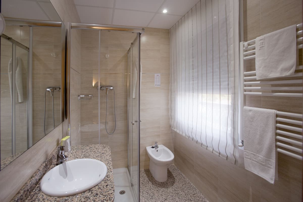 superior single room | bathroom | deep-soaking bathtub, free toiletries, hair dryer, towels