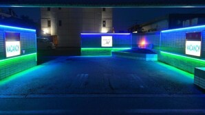 A parking area with neon signs indicating vacancies. - TERRACE M YOKOTA BASE - Adults Only (Mizuho)