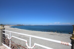 Walk along the beach on a serene coastal path, surrounded by the soothing sounds of the ocean.