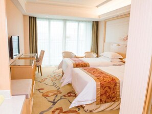 Habitación Deluxe con 2 camas individuales | Caja fuerte, escritorio, cortinas opacas y wifi gratis