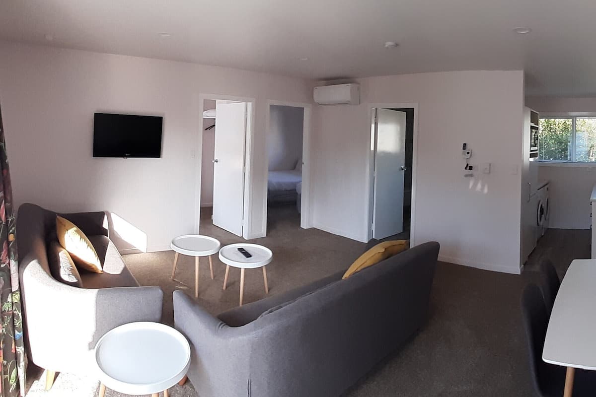 deluxe 2 bedroom unit | living area | flat-screen tv