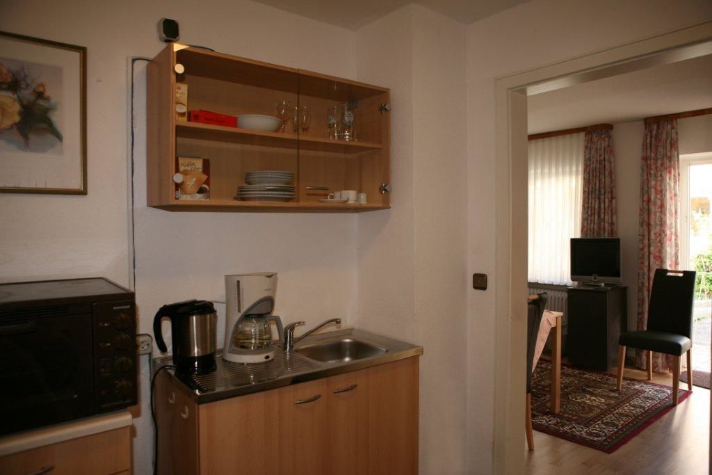 apartment, 2 bedrooms, ground floor (garden house) | private kitchenette | full-sized fridge, high chair, eco-friendly cleaning products