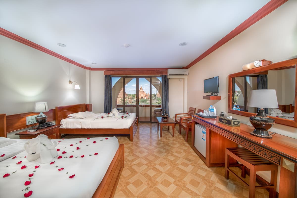 temple view deluxe, balcony | living area | flat-screen tv