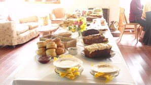 A buffet table with various baked goods and pastries. - Ariundle Accommodation (Acharacle)