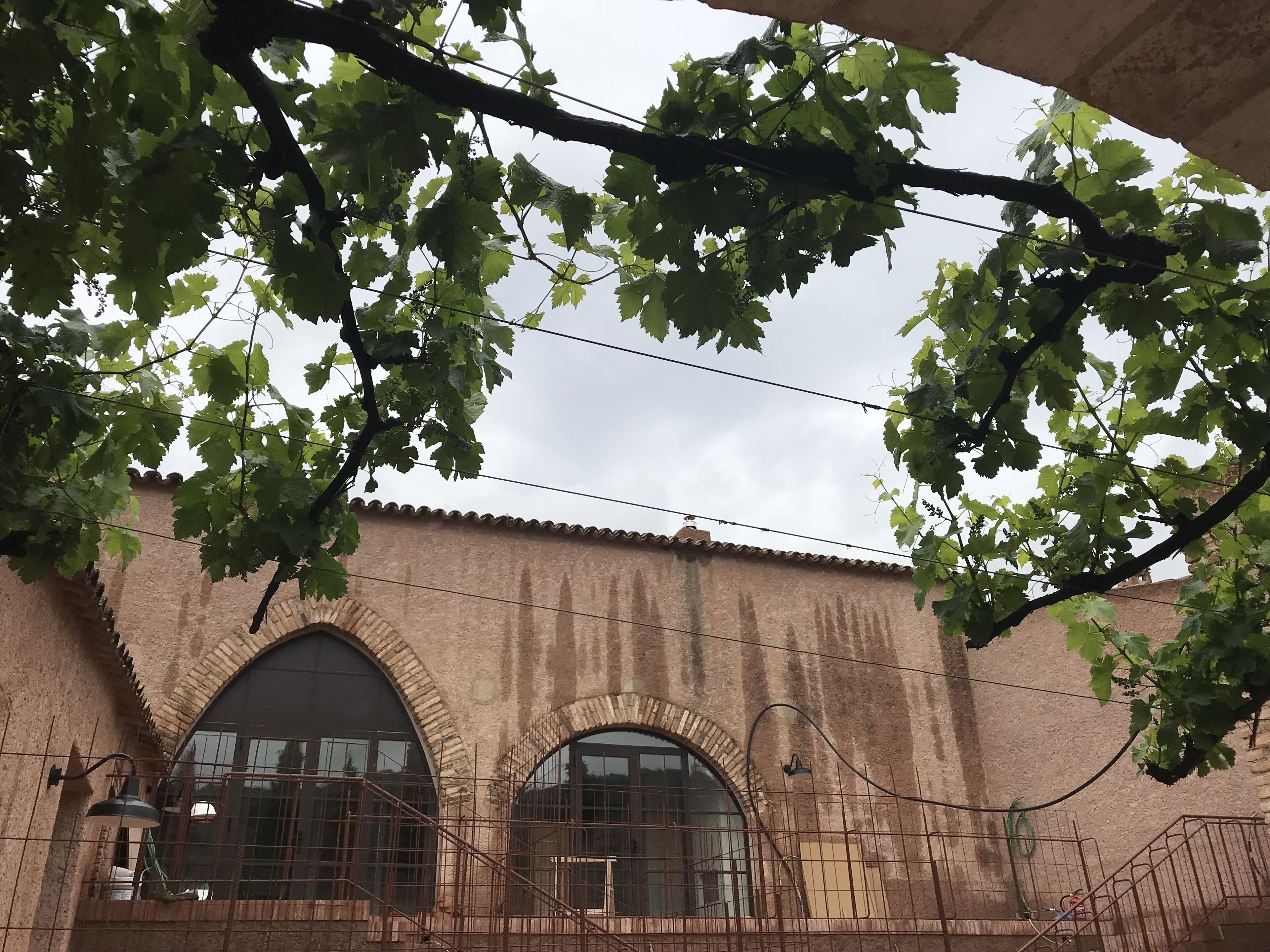 A building with arched windows and a brick facade.